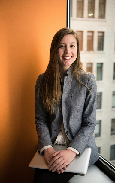 a young woman wearing formal clothes