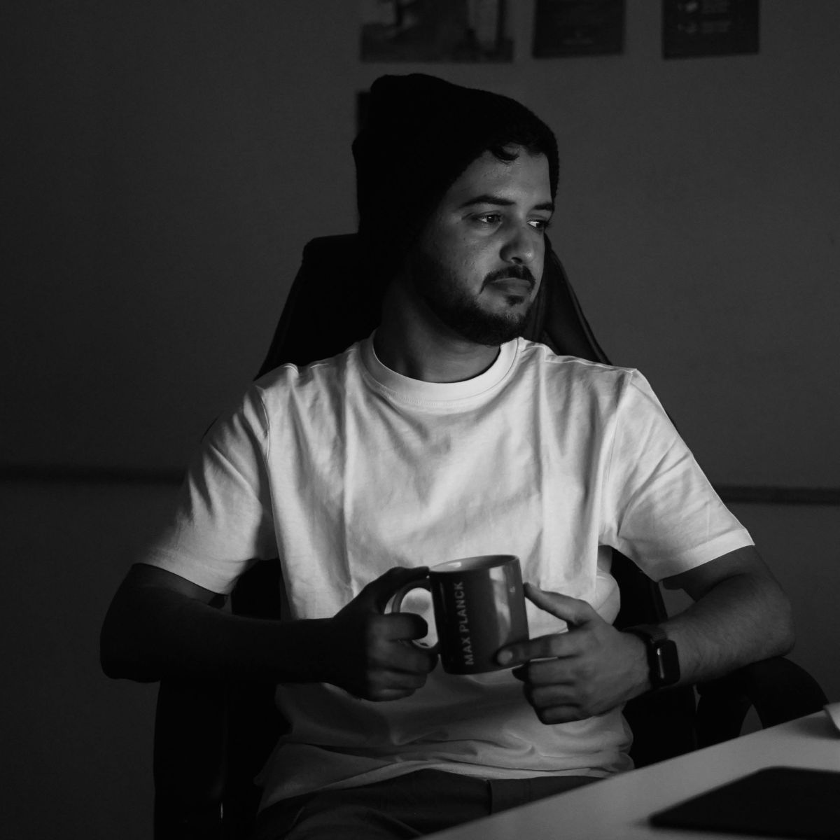 young man looking at their computer screen